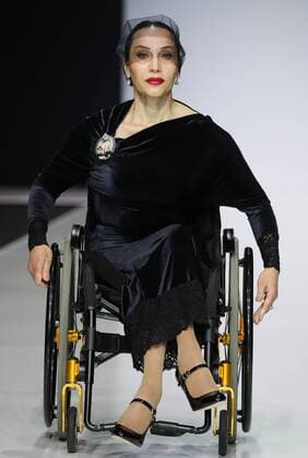 MOSCOW, RUSSIA - MARCH 23, 2017: A model in a wheelchair showcases a creation during a catwalk show for the NP Open World collection at the Moscow Fashion Week, at the Gostiny Dvor Shopping and Exhibition Centre. Open World is a non-profit partnership helping integrate people with disabilities. Vyacheslav Prokofyev TASS  TS04534E