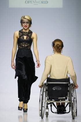 MOSCOW, RUSSIA - MARCH 23, 2017: A model in a wheelchair showcases a creation during a catwalk show for the NP Open World collection at the Moscow Fashion Week, at the Gostiny Dvor Shopping and Exhibition Centre. Open World is a non-profit partnership helping integrate people with disabilities. Vyacheslav Prokofyev TASS  TS04534F