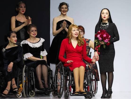 MOSCOW, RUSSIA - MARCH 23, 2017: Designer Tatiana Malchikova (2nd R) after a catwalk show for the NP Open World collection at the Moscow Fashion Week, at the Gostiny Dvor Shopping and Exhibition Centre. Open World is a non-profit partnership helping integrate people with disabilities. Vyacheslav Prokofyev TASS  TS045368