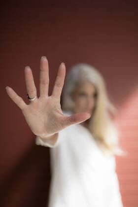 Woman showing hand palm model released Symbolfoto  GIOF02313