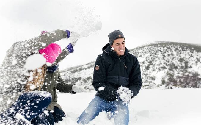 Friens having a snowball fight in the snow model released Symbolfoto  MGOF03048