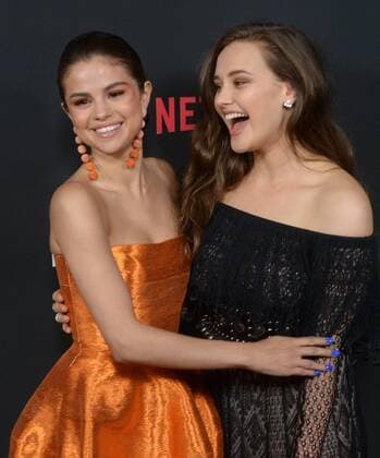 Executive producer and actress Selena Gomez (L) and cast member Katherine Langford attend the premiere of Netflix s 13 Reasons Why on the Paramount Pictures Studios lot in Los Angeles on March 30, 2017. Storyline: Follows teenager Clay Jensen, in his quest to uncover the story behind his classmate and crush, Hannah, and her decision to end her life.  LAP2017033011 JIMxRUYMEN