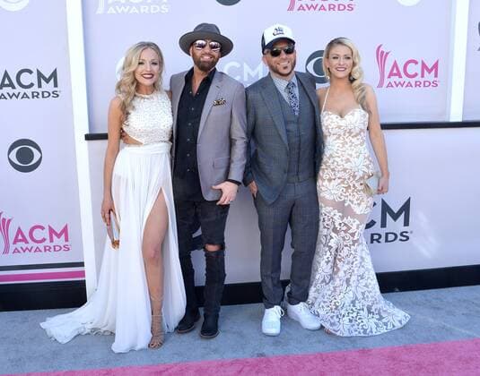 (L-R) Kristen White, musicians Preston Brust and Chris Lucas of LOCASH, and Kaitlyn Lucas attend the 52nd annual Academy of Country Music Awards held at T-Mobile Arena in Las Vegas, Nevada on April 2, 2017. The show will be telecast live on CBS.  LVP20170402339 JIMxRUYMEN