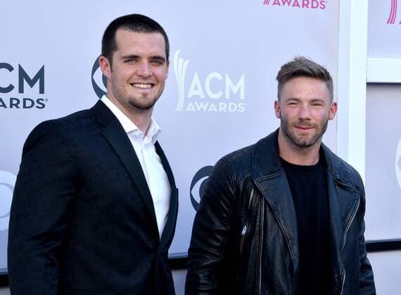NFL players Derek Carr and Julian Edelman attend the 52nd annual Academy of Country Music Awards held at T-Mobile Arena in Las Vegas, Nevada on April 2, 2017. The show will be telecast live on CBS.  LVP20170402390 JIMxRUYMEN