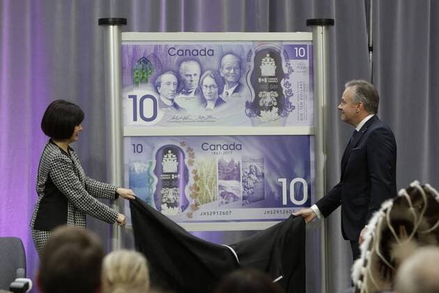 (170407) -- OTTAWA, April 7, 2017 -- Bank of Canada Governor Stephen Poloz (R) and Canadian parliamentary secretary to the minister of finance Ginette Petitpas Taylor unveil a 10-Canadian-dollar banknote in Ottawa, Canada, April 7, 2017. The Bank of Canada on Friday unveiled a commemorative 10-Canadian-dollar banknote to mark the 150th anniversary of the country. ) CANADA-OTTAWA-COMMEMORATIVE BANKNOTE-UNVEILING DavidxKawai 