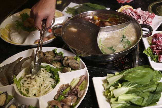 April 12, 2017 - St. Petersburg, Florida, U.S. - EVE EDELHEIT Times.Another option for cooking meat at the restaurant is by Hot Pot which is used to cook the meat, seafood and vegetables in different types of soups and broth at 66 Q-Pot Korean BBQ in Pinellas Park on Wednesday, April 13, 2017. St. Petersburg U.S. - ZUMAs70_ 20170412_zan_s70_026 Copyright: xEvexEdelheitx