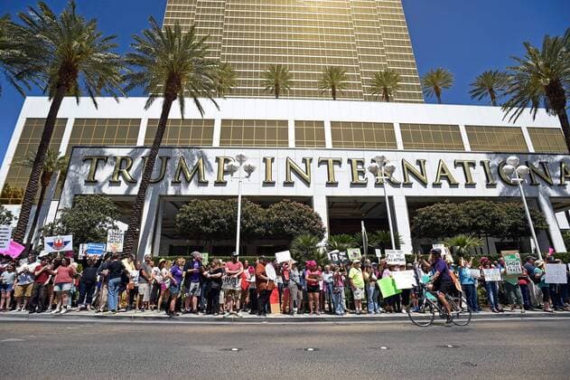 April 15, 2017 - Las Vegas, Nevada, U.S. - People participate in a Tax Day protest at the Trump International Tower on April 15, 2017, in Las Vegas, Nevada. Activists in cities across the nation are marching today to call on President Donald Trump to release his tax returns. Las Vegas USA - ZUMAbk3_ 20170415_zaf_bk3_008 Copyright: xDavidxBeckerx