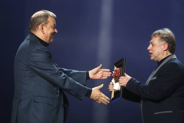 MOSCOW, RUSSIA - APRIL 19, 2017: Bolshoi Theatre Director Vladimir Urin (L) accepts an award for Opera Best Production for Rodelinda from Russian stage director and choreographer Mikhail Kislyarov at the 2017 Golden Mask award ceremony at the Stanislavsky and Nemirovich-Danchenko Moscow Music Theatre. Valery Sharifulin TASS  TS048E07