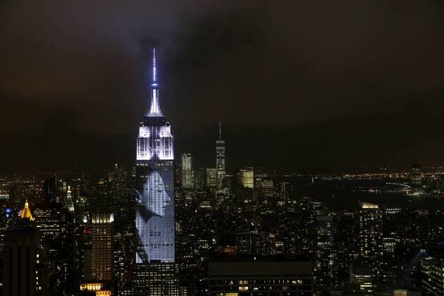 An artist rendering image is projected onto the Empire State Building in the Manhattan skyline to celebrate Harper Bazaar s 150th anniversary on April 19, 2017 in New York City. Spanning 42 floors of the building and rising 500 feet high, the show featured iconic fashion images of everyone from Audrey Hepburn to Kate Moss, including iconic works by the likes of Andy Warhol.  NYP20170419296 JOHNxANGELILLO