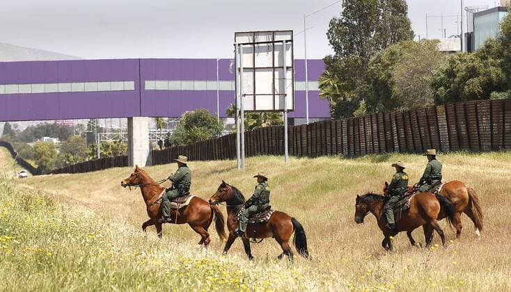 April 21, 2017 - San Ysidro, CA, USA - The San Diego Sector Customs and Border Protection horse patrol rode along the border with Mexico before a press conference featuring attorney general Jeff Sessions and Homeland Security Secretary John Kelly. At rigth in brown is the old border fence. In purple at top of photo is the Cross Border Xpress, a pathway for those in the United States to cross over, take and return from flights in Mexico at TijuanaÃ¢â‚¬â ¢s Rodriguez airport. San Ysidro USA - ZUMAga3_ 20170421_zap_ga3_012 Copyright: xJohnxGastaldox