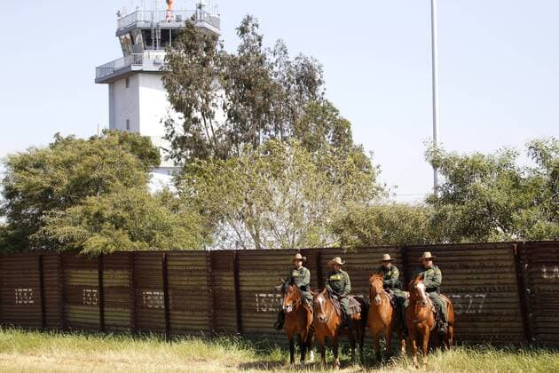 April 21, 2017 - San Ysidro, California, U.S.- The San Diego Sector Customs and Border Protection horse patrol rode along the border with Mexico before a press conference featuring attorney general Jeff Sessions and Homeland Security Secretary John Kelly. Behind them is the old border wall and beyond, the control tower for Tijuana s Rodriguez airport. San Ysidro U.S. - ZUMAga3_ 20170421_zap_ga3_010 Copyright: xJohnxGastaldox
