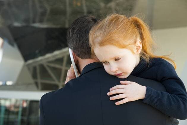 Businessman on the phone holding daughter model released Symbolfoto property released  CHAF01841