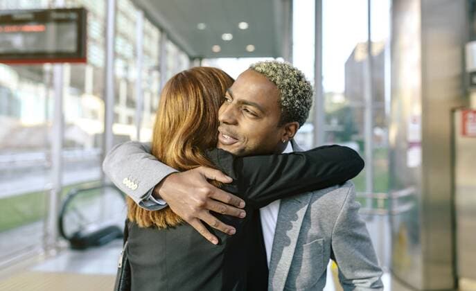 Young businessman and woman embracing at metro station model released Symbolfoto  DAPF00611