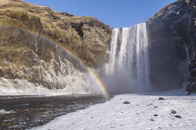 Iceland, Skogafoss waterfall with rainbow in winter  MELF00178