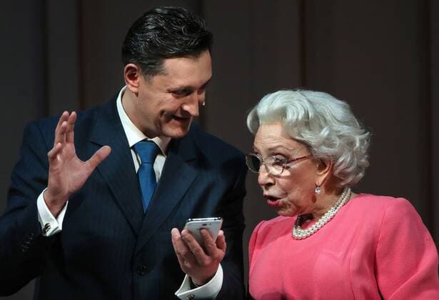 MOSCOW, RUSSIA - APRIL 24, 2017: Actor Oleg Maslennikov-Voitov (L) as David Cameron and actress Inna Churikova as Queen Elizabeth II in a scene during a pre-premiere of Peter Morgan s play The Audience staged by Gleb Panfilov at the Theatre of Nations. The play tells about Queen Elizabeth II s weekly meetings with prime ministers. Valery Sharifulin TASS  TS049789
