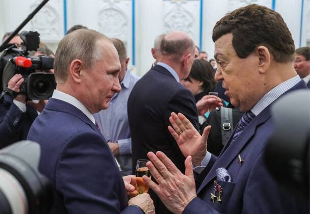 MOSCOW, RUSSIA - APRIL 28, 2017: Russia s President Vladimir Putin (L) and Russian State Duma member, singer Iosif Kobzon attend an award ceremony to present the Hero of Labour of the Russian Federation medals at Moscow s Kremlin. The Hero of Labour of the Russian Federation title is bestowed on Russian citizens for their contribution to Russia s society, economy, culture, education, industry, and agriculture. Mikhail Klimentyev Russian Presidential Press and Information Office TASS  TS04A018
