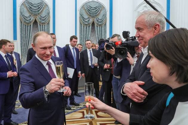 MOSCOW, RUSSIA - APRIL 28, 2017: Russia s President Vladimir Putin, actor Sergei Garmash and actress Chulpan Khamatova (L-R) drink champagne after an award ceremony to present the Hero of Labour of the Russian Federation medals at Moscow s Kremlin. The Hero of Labour of the Russian Federation title is bestowed on Russian citizens for their contribution to Russia s society, economy, culture, education, industry, and agriculture. Mikhail Klimentyev Russian Presidential Press and Information Office TASS  TS04A01A