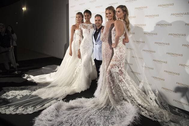Models Martha Hunt (L), Cindy Bruna (2L), Romee Strijd (2R), and Bregje Heinen, pose next to designer Hervé Moreau, during the Pronovias label show on the last day of the Barcelona Bridal Fashion Week in Barcelona, northeastern Spain, 28 April 2017. Barcelona Bridal Fashion Week !ACHTUNG: NUR REDAKTIONELLE NUTZUNG!  Copyright: xMARTAxPEREZx GRA319 20170428-636290198569707426
