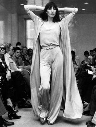 New York, New York: May 23, 1972 Angelica Huston models a Halston Originals jersey evening pants ensemble with a matching full coat. xUnderwoodxArchives 3-Fash-W-70_6 3-Fash-W-70_6HR