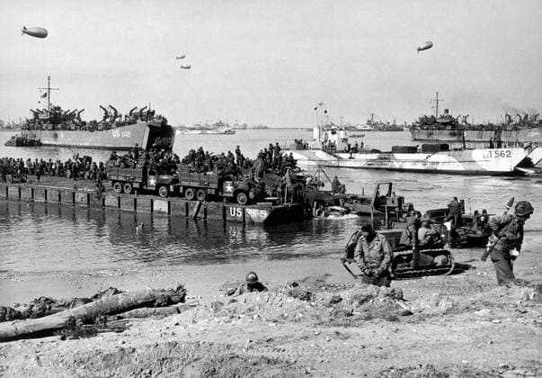Normandy, France: June 6, 1944 Navy Seabees pilot heavily-laden Rhino Ferries to the beaches of Normandy as the D-Day invasion of France begins. The Rhino Ferry is a Seebee concept, a long self-propelled pontoon barge that can run in close to a shallow beach. xUnderwoodxArchives 4-WWII-US-E-DDay_12 4-WWII-US-E-DDay_12HR