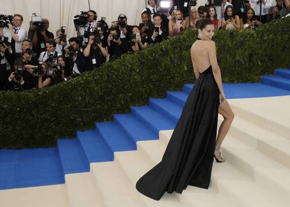 Adriana Lima arrives on the red carpet at the Costume Institute Benefit at The Metropolitan Museum of Art celebrating the opening of Rei Kawakubo Comme des Garcons: Art of the In-Between in New York City on May 1, 2017.  NYP20170501137 JOHNxANGELILLO