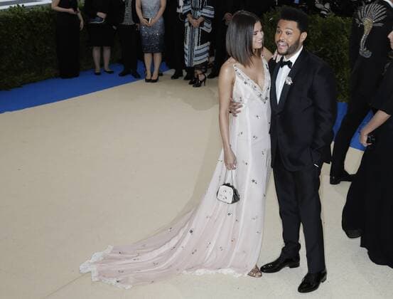 Selena Gomez and The Weeknd arrive on the red carpet at the Costume Institute Benefit at The Metropolitan Museum of Art celebrating the opening of Rei Kawakubo Comme des Garcons: Art of the In-Between in New York City on May 1, 2017.  NYP20170501167 JOHNxANGELILLO