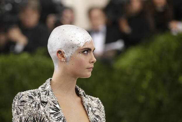 Cara Delevingne arrives on the red carpet at the Costume Institute Benefit at The Metropolitan Museum of Art celebrating the opening of Rei Kawakubo Comme des Garcons: Art of the In-Between in New York City on May 1, 2017.  NYP20170501555 JOHNxANGELILLO