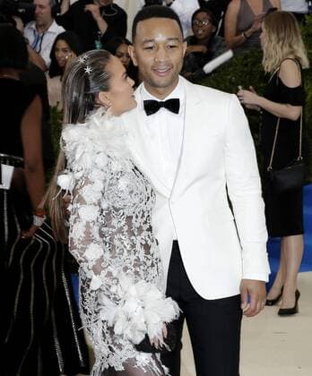 John Legend and Chrissy Teigen arrive on the red carpet at the Costume Institute Benefit at The Metropolitan Museum of Art celebrating the opening of Rei Kawakubo Comme des Garcons: Art of the In-Between in New York City on May 1, 2017.  NYP20170501556 JOHNxANGELILLO