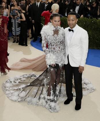 John Legend and Chrissy Teigen arrive on the red carpet at the Costume Institute Benefit at The Metropolitan Museum of Art celebrating the opening of Rei Kawakubo Comme des Garcons: Art of the In-Between in New York City on May 1, 2017.  NYP20170501557 JOHNxANGELILLO