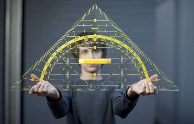 Schueler mit einem Geodreieck . Hannover , Deutschland . Student holding a big triangle . Hannover , Germany . 12.02.2009 , MODEL RELEASE vorhanden , MODEL RELEASED , Hannover DEU, Deutschland Copyright: xUtexGrabowskyx