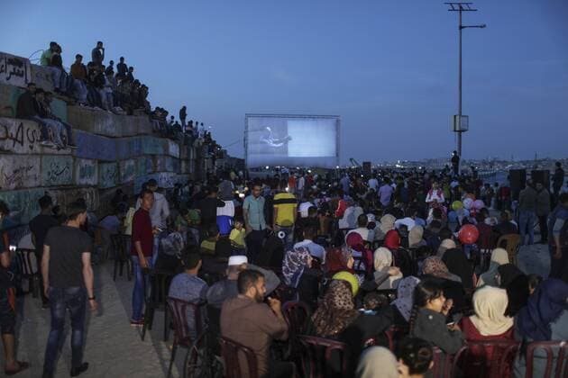 (170513) -- GAZA, May 13, 2017 -- Palestinians see a film during the opening ceremony of the Red Carpet Festival in Gaza City, on May 12, 2017. The Red Carpet is a festival for short and long narrative and documentary films. ) (gj) MIDEAST-GAZA-FILM FESTIVAL WissamxNassar 