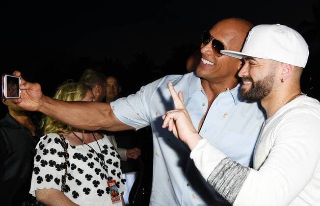 Cast member Dwayne Johnson takes a selfie with Nacho at the US premiere of the motion picture Baywatch in Lummus Park, Miami Beach, Florida, May 13, 2017. The movie is a remake of the TV series that ran from 1989-2001.  MIA20170513179 GARYxIxROTHSTEIN