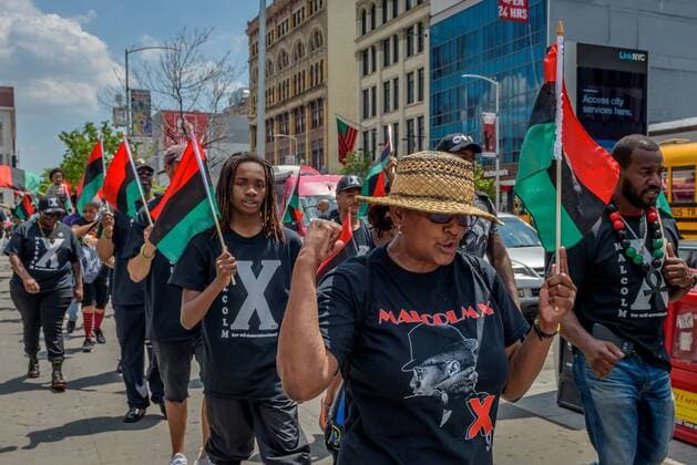 NYC: 28th Malcolm X march In honor of the 92nd Anniversary of the birth of black national hero, Malcolm X, on May 19, 2017; members of December 12th Movement, Black Lives Matter Greater New York and Harlem residents gathered outside Adam Clayton Powell State Office Building, 163 W. 125th St. to hold the 28th annual black power Shut ‘Em Down rally and march.  ErikxMcGregor