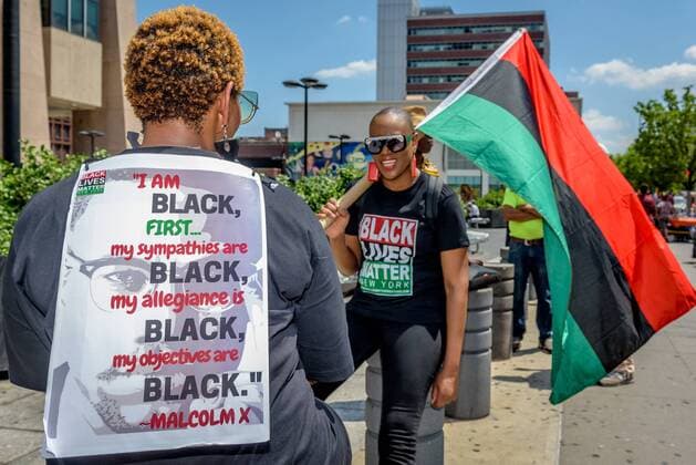 NYC: 28th Malcolm X march In honor of the 92nd Anniversary of the birth of black national hero, Malcolm X, on May 19, 2017; members of December 12th Movement, Black Lives Matter Greater New York and Harlem residents gathered outside Adam Clayton Powell State Office Building, 163 W. 125th St. to hold the 28th annual black power Shut ‘Em Down rally and march.  ErikxMcGregor