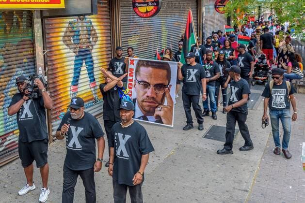 NYC: 28th Malcolm X march In honor of the 92nd Anniversary of the birth of black national hero, Malcolm X, on May 19, 2017; members of December 12th Movement, Black Lives Matter Greater New York and Harlem residents gathered outside Adam Clayton Powell State Office Building, 163 W. 125th St. to hold the 28th annual black power Shut ‘Em Down rally and march.  ErikxMcGregor