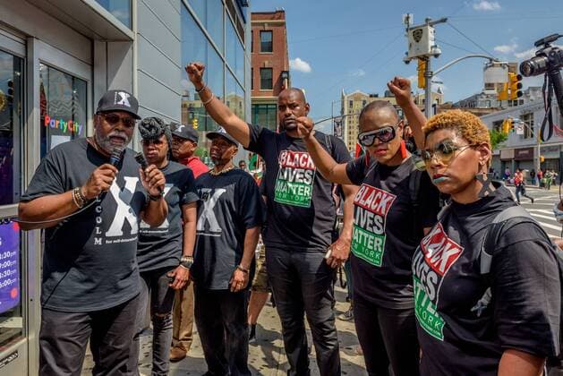 NYC: 28th Malcolm X march In honor of the 92nd Anniversary of the birth of black national hero, Malcolm X, on May 19, 2017; members of December 12th Movement, Black Lives Matter Greater New York and Harlem residents gathered outside Adam Clayton Powell State Office Building, 163 W. 125th St. to hold the 28th annual black power Shut ‘Em Down rally and march.  ErikxMcGregor