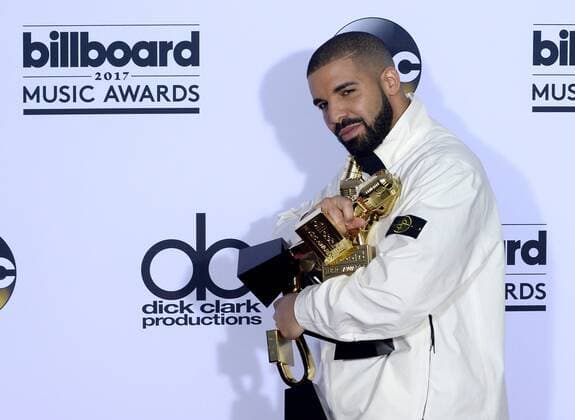 Recording artist Drake appears backstage with his awards for Top Artist, Top Male Artist, Top Billboard 200 Artist, Top Billboard 200 Album for Views, Top Hot 100 Artist, Top Song Sales Artist, Top Streaming Artist, Top Streaming Song (Audio) for One Dance, Top R&B Song for One Dance, Top R&B Collaboration for One Dance, Top Rap Artist, Top Rap Album for Views, and Top Rap Tour, during the annual Billboard Music Awards held at T-Mobile Arena in Las Vegas, Nevada on May 21, 2017. This year?s show will air live on both coasts at 8 p.m. ET on ABC. LAV201705211016 JIMxRUYMEN