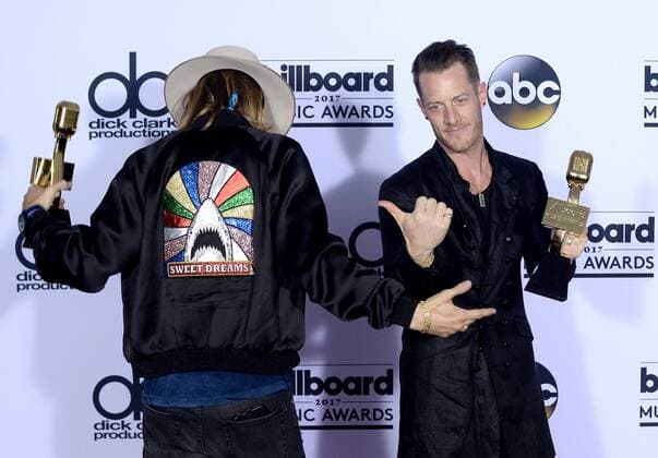 Recording artists Brian Kelley (L) and Tyler Hubbard of music group Florida Georgia Line appear backstage with their Top Country Song award for H.O.L.Y., during the annual Billboard Music Awards held at T-Mobile Arena in Las Vegas, Nevada on May 21, 2017. This year?s show will air live on both coasts at 8 p.m. ET on ABC.  LAV201705211003 JIMxRUYMEN