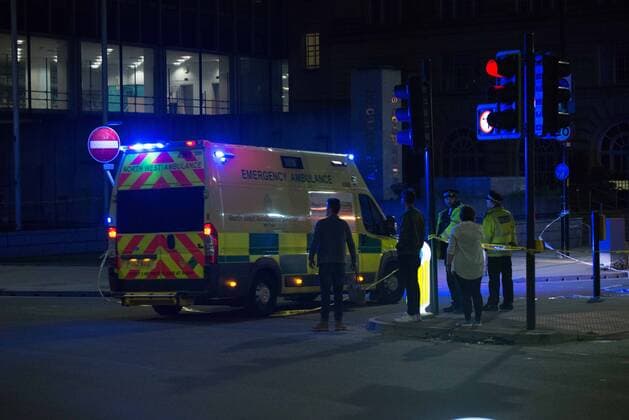 May 23, 2017 - Manchester, England, United Kingdom - An ambulance goes in to the cordoned off area, outside the Manchester Arena, after an explosion after the Ariana Grande concert which took place on 05 22 2017 at Manchester Arena in Manchester, United Kingdom on Tuesday, May 23rd, 2017. Greater Manchester Police are treating this as terrorist incident. Manchester United Kingdom  - ZUMAn230 20170523_zaa_n230_033 Copyright: xJonathanxNicholsonx