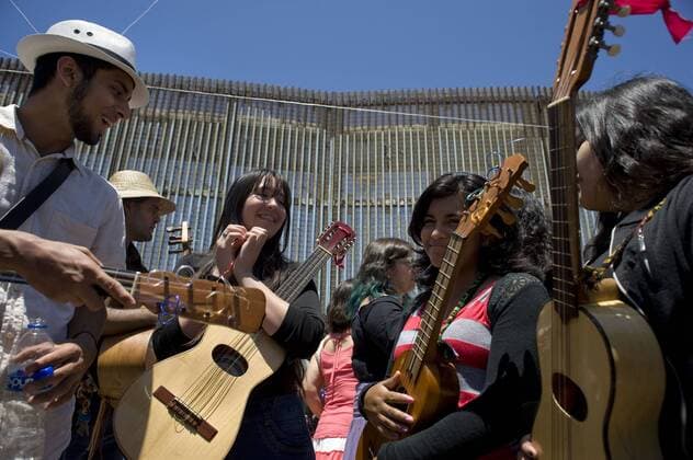 Musicians take a break between songs at the U.S.-Mexico border fence during the 10th annual Fandango Fronterizo music event in Tijuana, Mexico, on May 27, 2017. The event featured musicians and dancers who play the traditional Mexican music called Son Jarocho who played simultaneously on both sides of the border fence. Several hundred people came out for the event. 10th annual Fandango Fronterizo music event in Tijuana !ACHTUNG: NUR REDAKTIONELLE NUTZUNG!  Copyright: xDavidxMaungx MEX71 20170528-636315354108271883