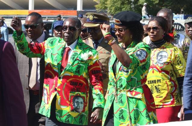 (170603) -- HARARE, June 3, 2017 -- Zimbabwean President Robert Mugabe (L, front) and his wife Grace (R, front) gesture to supporters in the Mashonaland East provincial capital Marondera, about 80 km south of Harare, Zimbabwe, June 2, 2017. Robert Mugabe on Friday begins a series of interactive meetings with the ruling Zanu-PF s youths ahead of the 2018 elections in which he has been endorsed at the party s presidential candidate. (zw) ZIMBABWE-MARONDERA-MUGABE ZhangxYuliang 