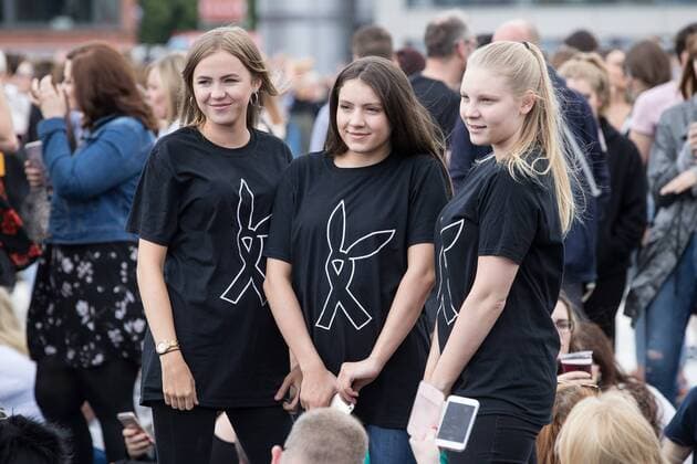 June 4, 2017 - Manchester, Greater Manchester, UK - Manchester , UK . Three girls wearing t-shirts with the One Love Manchester symbol on their t-shirts as the crowd gathers in front of the stage . The One Love Manchester benefit concert for victims of the Manchester Arena terrorist attack , at the Emirates Old Trafford Cricket Stadium . Ariana Grande, Justin Bieber, Coldplay, Katy Perry, Miley Cyrus, Pharrell Williams, Usher, Take That, Robbie Williams, Black Eyed Peas and Niall Horan are amongst the performers Manchester UK - ZUMAl94_ 20170604_zaf_l94_187 Copyright: xJoelxGoodmanx
