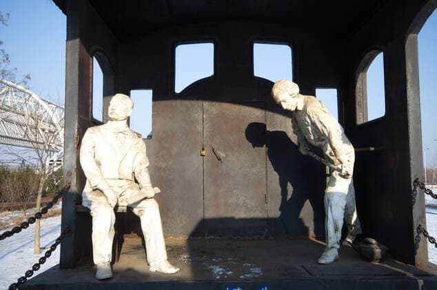 June 16, 2017 - Qinhuangdao, Qinhuangdao, China - Qinhuangdao, CHINA-Jan 17 2016: (EDITORIAL USE ONLY. CHINA OUT) An old train and sculptures of passengers can be seen near the Beidaihe Railway Station in Qinhuangdao, north China s Hebei Province. Qinhuangdao China  - ZUMAs145 20170616_zaa_s145_118 Copyright: xFengxJunx