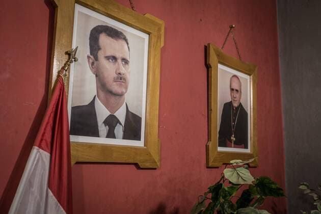 - SYRIA - THE MARTYRDOM OF KHABOUR S ASSYRIANS - 17 12 2016 - northern syria Hassake Hassake - Syria Nord Dec16 - In a Catholic church, the portrait of Bashar el Assad is hung next to that of the Archbishop. Assad has always protected the Christian minorities, who are his allies in the north.  ChrisxHubyx xLexPictorium LePictorium_0159712