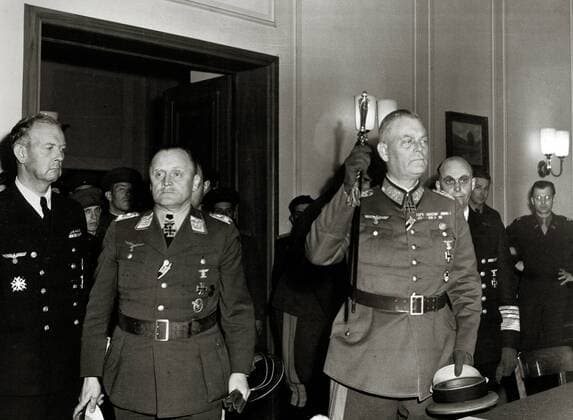 Colonel-General Paul Stumpff, second left, Luftwaffe commander; Field Marshal Wilhelm Keitel, German army commander, raising baton; and General Admiral Hans von Freideburg, rear, commander of the German navy; emerge after Germany s unconditional surrender was formally ratified in Berlin, May 9, 1945  1003_679THA