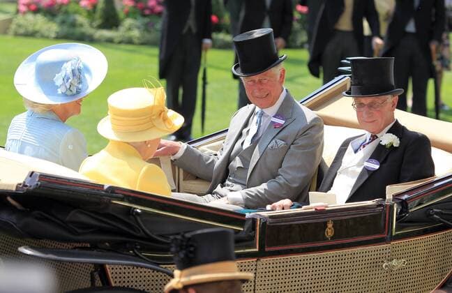 Her Majesty The Queen, The Duchess of Cornwall and Charles, Prince of Wales are pictured as they arrive by horse and carriage at day two of Royal Ascot 2017 in Ascot, England, as one of the leading horse racing events in the United Kingdom continues. The Queen sports a summery look as she enjoys the golden sunshine as she arrives in a yellow hat and overcoat. JUNE 21st 2017  MTXx171310