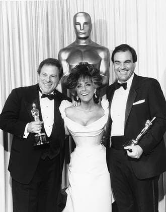 Oliver Stone, Elizabeth Taylor at the 59th Annual Academy Awards, 1987 Hollywood CA USA  Copyright: xAMPASx 32509_436THA