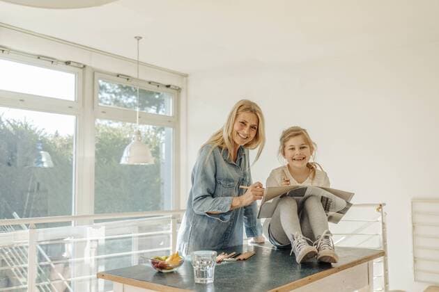 Mature woman and girl at home drawing together model released Symbolfoto property released  JOSF00794