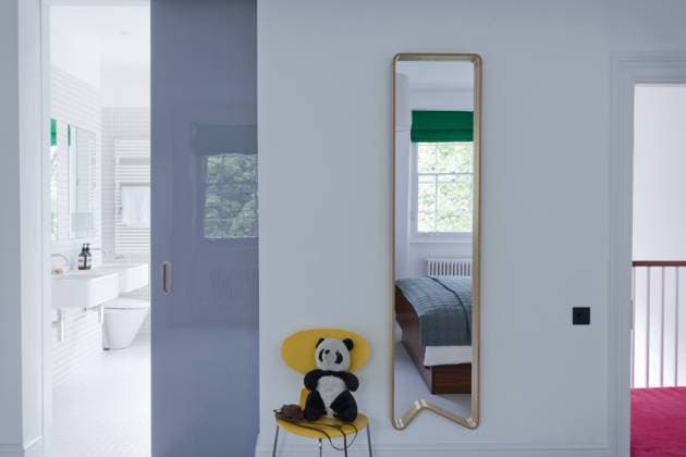 Hall mirror with view through sliding door to bathroom in London home, UK. United Kingdom  Copyright: xPedroxSilmonx 13214-300-1