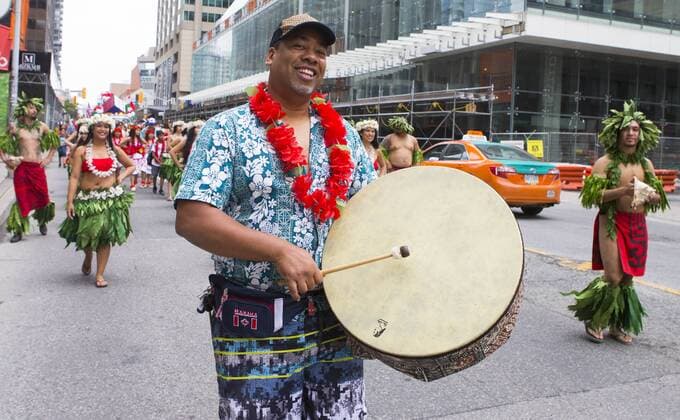 (170702) -- TORONTO, July 2, 2017 -- Dressed up participants perform during the 2017 Canada Day Parade in Toronto, Canada, July 1, 2017. About 1,500 participants in different traditional costumes participated in this event to celebrate Canada s 150th Birthday on Saturday in Toronto. ) (zxj) CANADA-TORONTO-CANADA DAY PARADE ZouxZheng 